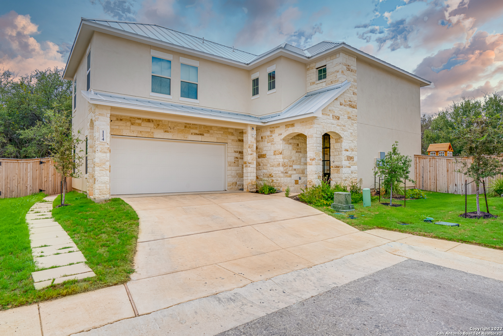 Located near Sea World and Lackland Air Force Base, this immaculate and almost brand new and lightly lived in Imagine Home is ready for its next family! This home is immaculate, well-constructed, energy efficient, and features TONS of upgrades! Enjoy entertaining in this open concept floor plan with plenty of space, neutral colors and natural light. Take your party outside to the well manicured backyard (artificial grass) with a privacy fence, playscape and ample room on the covered patio for outdoor seating, grilling and a splash in the hot tub. The kitchen boasts an oversized center island, energy efficient stainless steel appliances, granite countertops and 42" Maple, "Shaker" style cabinets. On your way upstairs to all of the bedrooms you can have a seat in a quaint reading nook or use it as a workspace. Come see this like new, modern style home with energy saving features and environmental friendly construction in a convenient location!