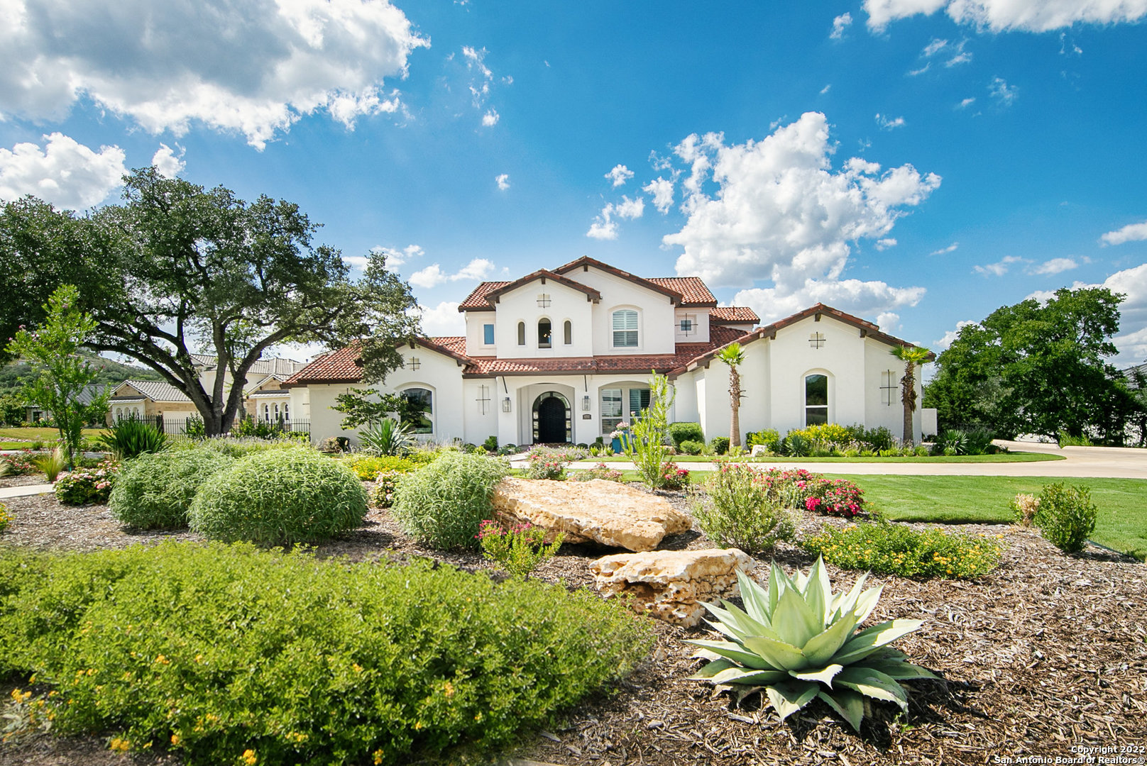 This stunning McNair Custom Home is located in the privately gated community of Cantera Hills. This architectural masterpiece boasts elements of both Spanish and contemporary intertwined with a Texas Hill Country flare. Upon entry you will notice a gorgeous view of your outdoor oasis along with an elegantly curved staircase and plenty of natural light. The luxurious finishes and attention to detail is stated in every room with wood flooring throughout, high ceilings, open-concept living and sliding glass doors providing that perfect indoor-outdoor flow. Four bedrooms, four full and two half baths, study, dining room with a wet bar and wine cellar, chefs kitchen with custom cabinets and stainless steel high-end appliances, master suite with walk-through shower and private patio overlooking the Texas Hill Country. There is plenty of space for entertaining with a secondary game room on the main level along with a flex space on the secondary level. Enjoy your custom built Keith Zars inground pool and spa along with a beautiful covered patio and outdoor kitchen. McNair Custom Homes are well-known for their energy efficiency built homes and quality. Schedule your today!