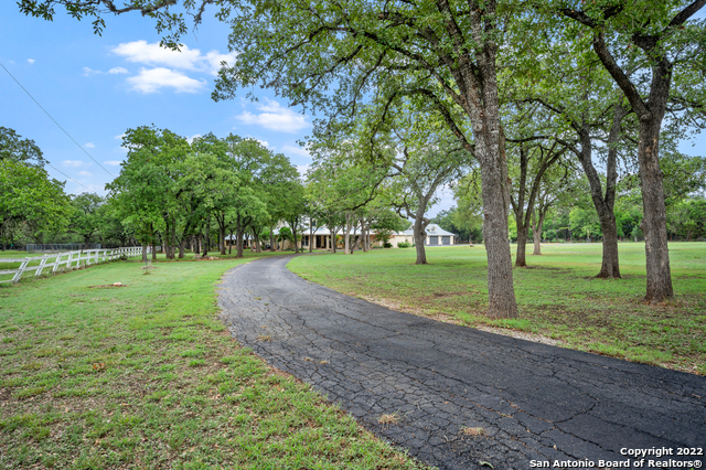 Typically when you see a "one-of-a-kind" property listed for sale, that means there are 9 others just like it nearby and the agent couldn't think of anything unique to say.  Not the case with this one though. Located on 5 acres just two minutes from IH-10 and Boerne Stage Rd, this one is special. And truly "one-of-a-kind".  This mostly single-story (only one room up) Hill Country style home has been recently remodeled and is a perfect setting for a family. The bedrooms are large. The pool, cabana, and outdoor entertaining area are perfect for large gatherings or just hanging out and grilling with the family.     Car guys (and car gals...we don't discriminate) are going to love this place. In addition to the attached 2-car garage and the detached 3-car garage, there's a huge RV barn in the back of the property that can also be used as a home gym, boat storage, car workshop, or whatever else you can dream up.     This one is cool.
