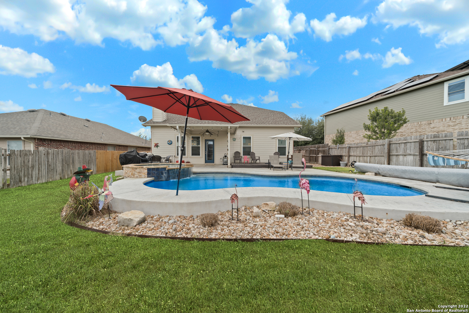 Pool season never ends at this New Braunfels gem with its NEW HEATED POOL & SPA that opened for endless water fun 4th of July 2021! You'll want to spend all your time outside under the covered patio or on the extended deck grilling--but once you do come inside, there's plenty to love there too! There have been numerous top-of-the-line UPGRADES including: ALL NEW WINDOWS (October 2019), NEW 20-SEER TRANE HVAC (July 2020), NEW ROOF (August 2022), NEW HOT WATER HEATER (December 2019), NEW EXTERIOR DOORS (October 2019)... ask for a copy of the features list for all the fun details on these quality upgrades. Downstairs you'll find a flexible bonus room that could be a formal dining room, study, or second living room; a spacious kitchen with island and gas cooking; a cozy living room with updated fireplace and updated wood laminate flooring; spacious owners suite. Upstairs has 3 large bedrooms surrounding the ultimate loft/game room with a built-in desk.  So much to see-and did we mention HEATED POOL!