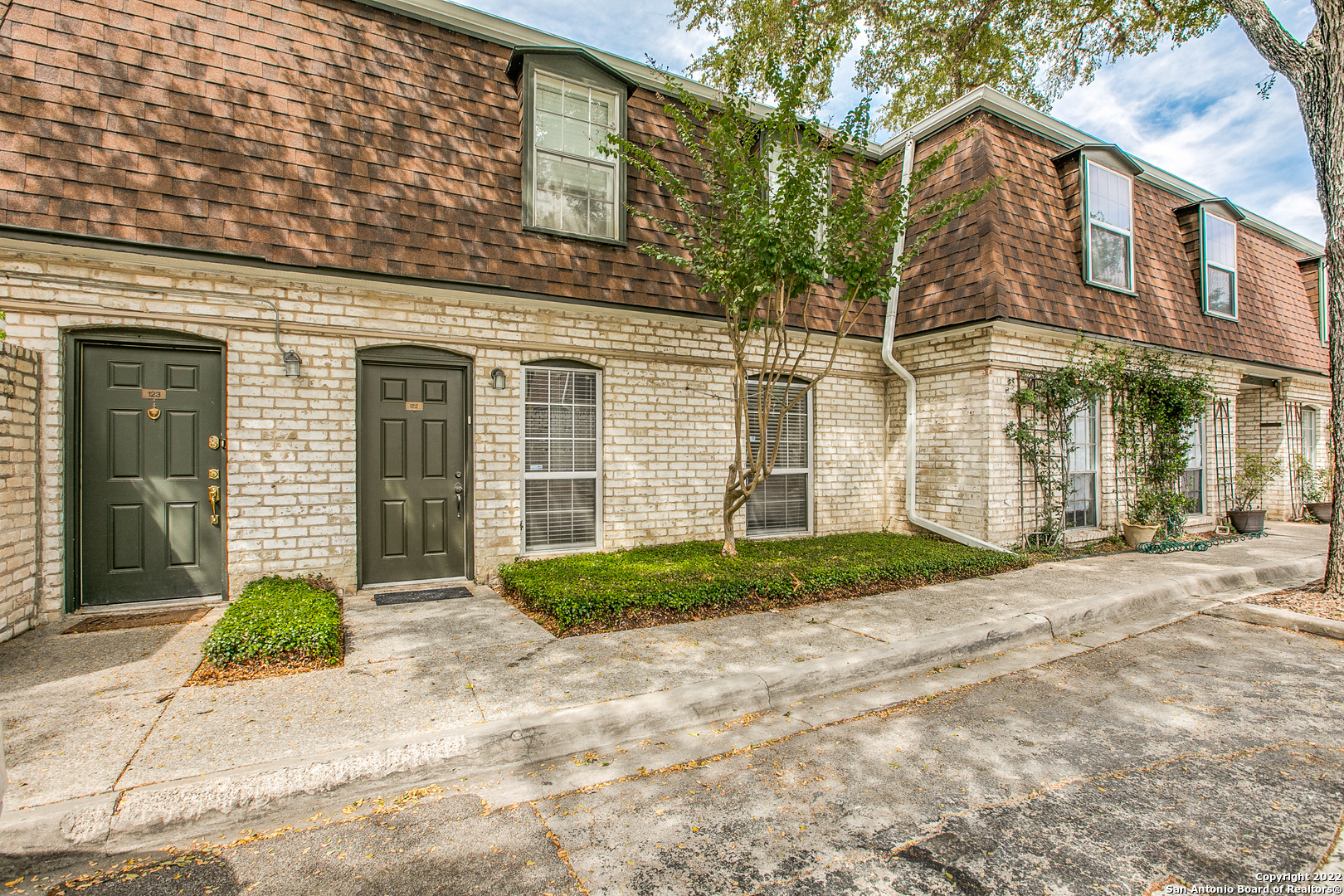 Recently and meticulously remodeled,this 2 bed, 2 bath single-story, ground-floor condo unit in Olmos Park Gardens has +/- 1090 square feet and is part of a 68-unit, well-established enclave community in Alamo Heights ISD! Just off Olmos Drive and situated among majestic oak trees, this unit is move-in ready with great modern features including granite countertops, stainless steel appliances, new kitchen cabinets, flooring, fixtures, lighting and fresh interior paint.  The bedrooms are nicely sized, both with walk-in closets and private bathroom access.  There French doors off the living/dining area that lead to a quaint, private patio.  Your one covered parking spot is just outside the unit's side door.  The complex has a pool, clubhouse and is professionally managed.  It's San Antonio/AHISD condo living at its very best! Come see it today.