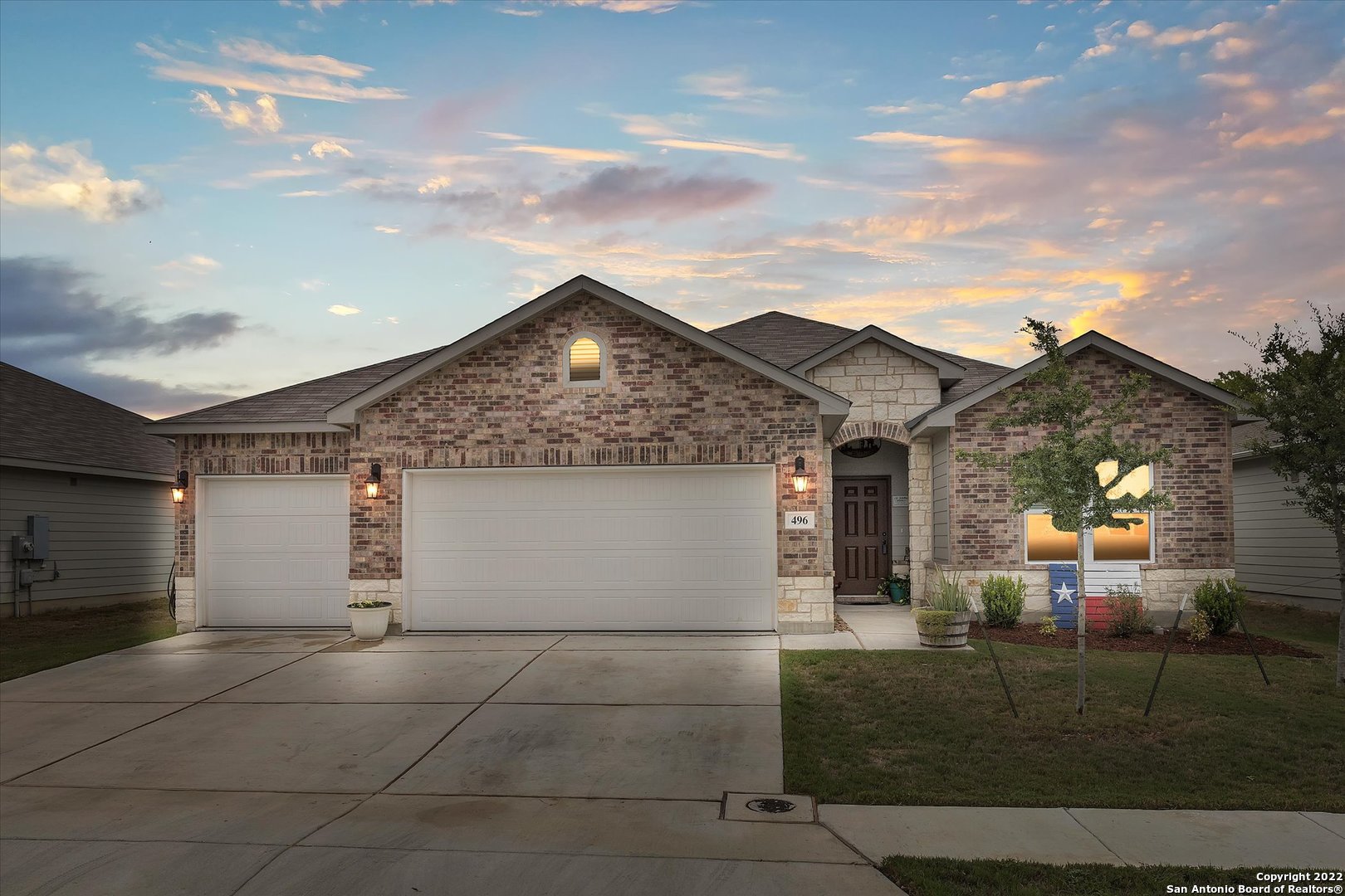 No showings until Saturday, September 10th. Located just minutes from shopping, restaurants, and a variety of parks, this stunning New Braunfels home is ready for its new owner! Pulling up, you'll notice the huge attached garage.Inside, the one-story house features 4 beds, 2 bathrooms, and 1,821 sq. feet. Gorgeous wood floors welcome you in the foyer and throughout the main floor. The spacious living room offers plenty of natural lighting and neutral warm colors that open up the space making it airy and inviting. Hungry? Just steps away is the large, eat-in kitchen, fully equipped with stainless steel appliances, beautiful wood cabinets, and a huge island/breakfast bar. An abundance of space is available for meal prep and storage! The primary suite is like your own private getaway, complete with a walk-in closet and a private bathroom with a walk-in shower and a double vanity.  Outdoor gatherings are best held on the cozy covered patio overlooking the wide, fenced-in property with no neighbors at the back. When warm weather rolls back around, fire up the grill with a bar or soak your troubles away in the outdoor steel tub while furry friends run around! Around the corner, you'll also find garden plots perfect for nurturing your own herbs and vegetables! Want to see 496 Long Leaf Dr in person? Don't wait! Schedule a private showing with your favorite agent today!