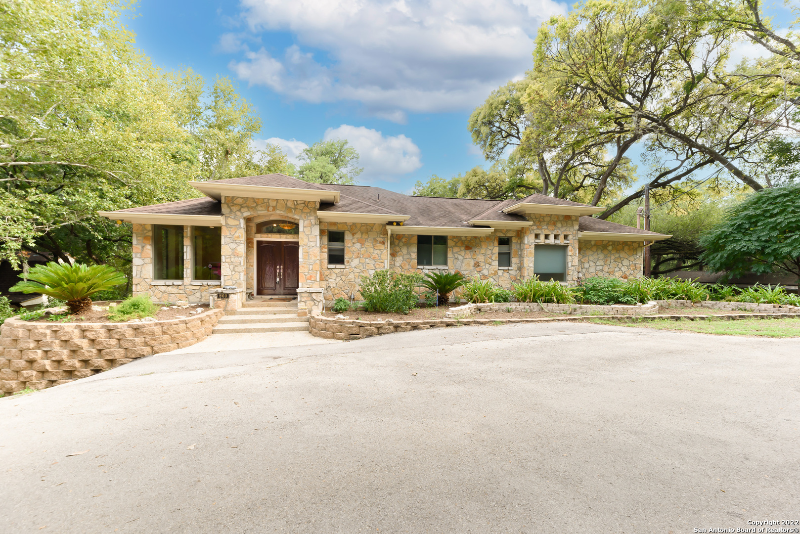 Don't miss this luxury custom built home that has been meticulously maintained and perched high to enjoy the Best Views of the Guadalupe River. This one in a million home has over 4800 sq ft living space, 170 ft river front, multiple tiered decks/seating areas, 4 bedrooms, 4.5 bathrooms, to use as your Primary Residence or Vacation Rental income potential. This exquisite residence embodies extreme quality. The home boast beautiful tile floors and vaulted ceiling. The open kitchen keeps the entertaining easy with a built-in Sub Zero refrigerator and the full wet bar in the dinning room. This impeccable home continues with details that will satisfy everyone's request. Two large living rooms for great gatherings and space. The second lot hosts bungalows set up to increase the opportunity for short term rental potential. This is a home that you must see to appreciate.