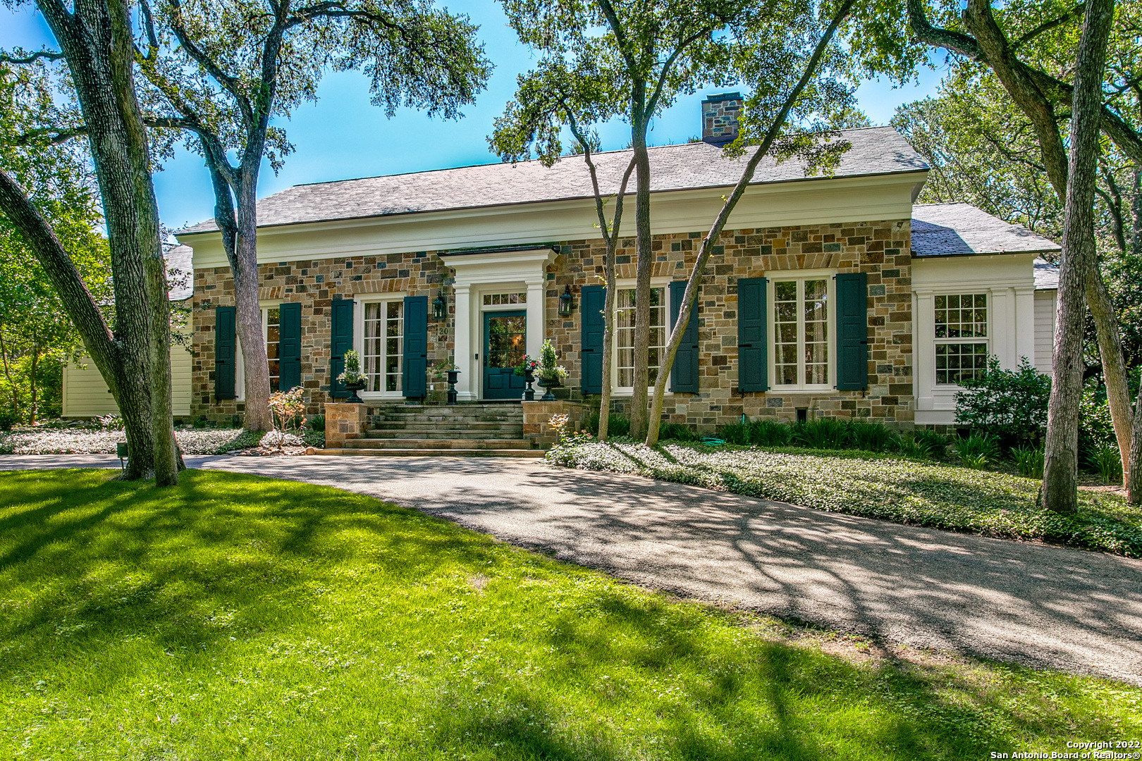 Situated on one of San Antonio's most desirable streets, this grand estate was built in 1927 by the Foster/Vaughn lumber family. Quality milled wood is on display throughout the interior of the home with many exceptional details. This beautiful home sits on nearly an acre of land, on a corner lot filled with stately oak trees and mature landscaping. The home is one of Alamo Heights earliest homes in this area. The home has four bedrooms, five bathrooms, one half bath, various living areas, beautiful pool, gazebo, three-car garage and large circular drive. AHISD highly acclaimed schools and close proximity to restaurants, airport and shopping.