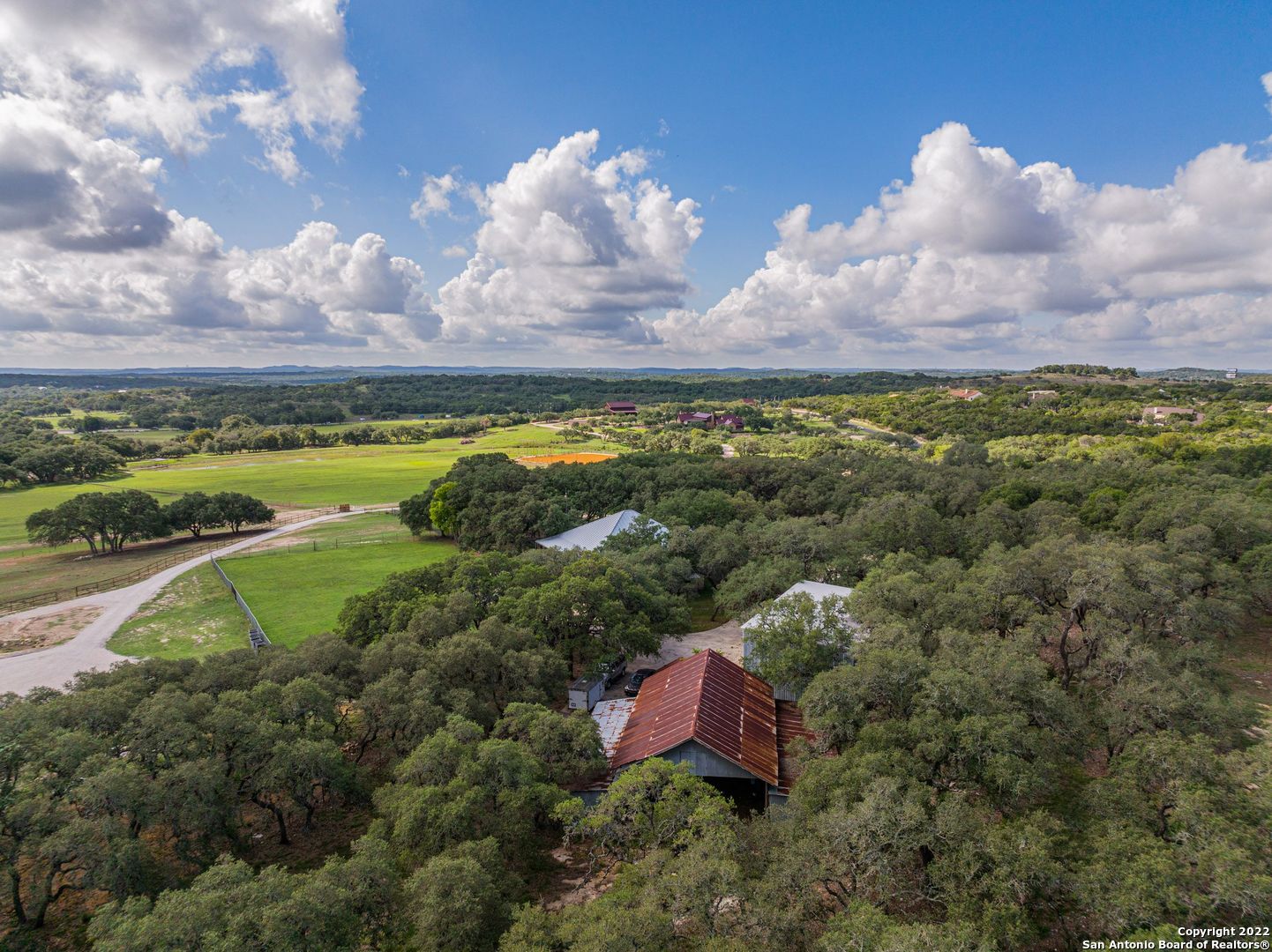 Beautiful historical property in Boerne!  This one of a kind home sits on almost 7 acres, has tons of mature oak trees, rustic barn and workshop to hold all of your outdoor machinery or livestock. The original part of the home has the original wood flooring, windows with architectural framing, high ceilings, doors, hardware and wainscoting. Gorgeous hill country views relaxing on the back porch or sitting on the balcony.  Property would make a fantastic bed and breakfast.