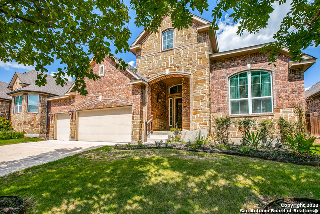 Motivated Seller!!  New price adjustment for this gorgeous ONE OF A KIND Chesmar Home is located in the highly desirable Alamo Ranch area.  The 1.5 story home has a bonus media/game room and a full bath upstairs, a guest bedroom with an ensuite on the main level and two bedrooms with their very own living room area.  If you are looking for an oversized kitchen look no further.  This kitchen has granite counter tops with endless counter space, tall cabinets, stainless steel appliances, gas cooking and a HUGE island perfect for entertaining.  The office is conveniently located next to the primary bedroom as well as a covered lanai for all to enjoy.  Come see this stunning home today!!