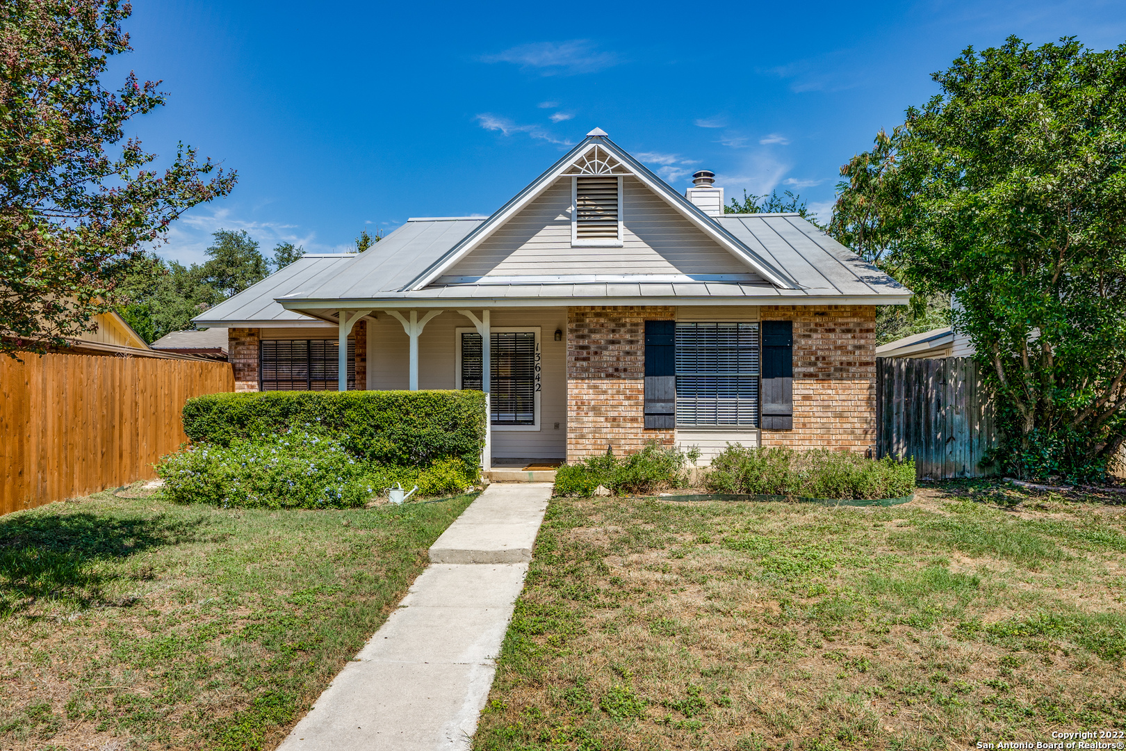 Beautifully remodeled with attention to detail, this cottage on a cul-de-sac is a perfect fit for the discerning buyer seeking a low-maintenance garden home lifestyle. Nestled in the desirable Castle Hills Forest subdivision, this single-story charmer is within walking distance to the popular Salado Creek hike & bike trail and Hardberger Park.  The voluntary neighborhood association has a well-maintained park with a pool, playground and sports courts (fee to join). Quick access to upscale shopping and restaurants, the medical center, and the airport. The living and dining area features high ceilings, built-in storage and a fireplace with shiplap accents. The large, bright kitchen boasts butcher block countertops and space for an island or additional dining area; French doors lead to the expanded shaded patio and yard with a storage shed for your garden tools. The large master bedroom has additional outside access to a private patio for morning coffee or an evening rest.  Schedule your showing today!