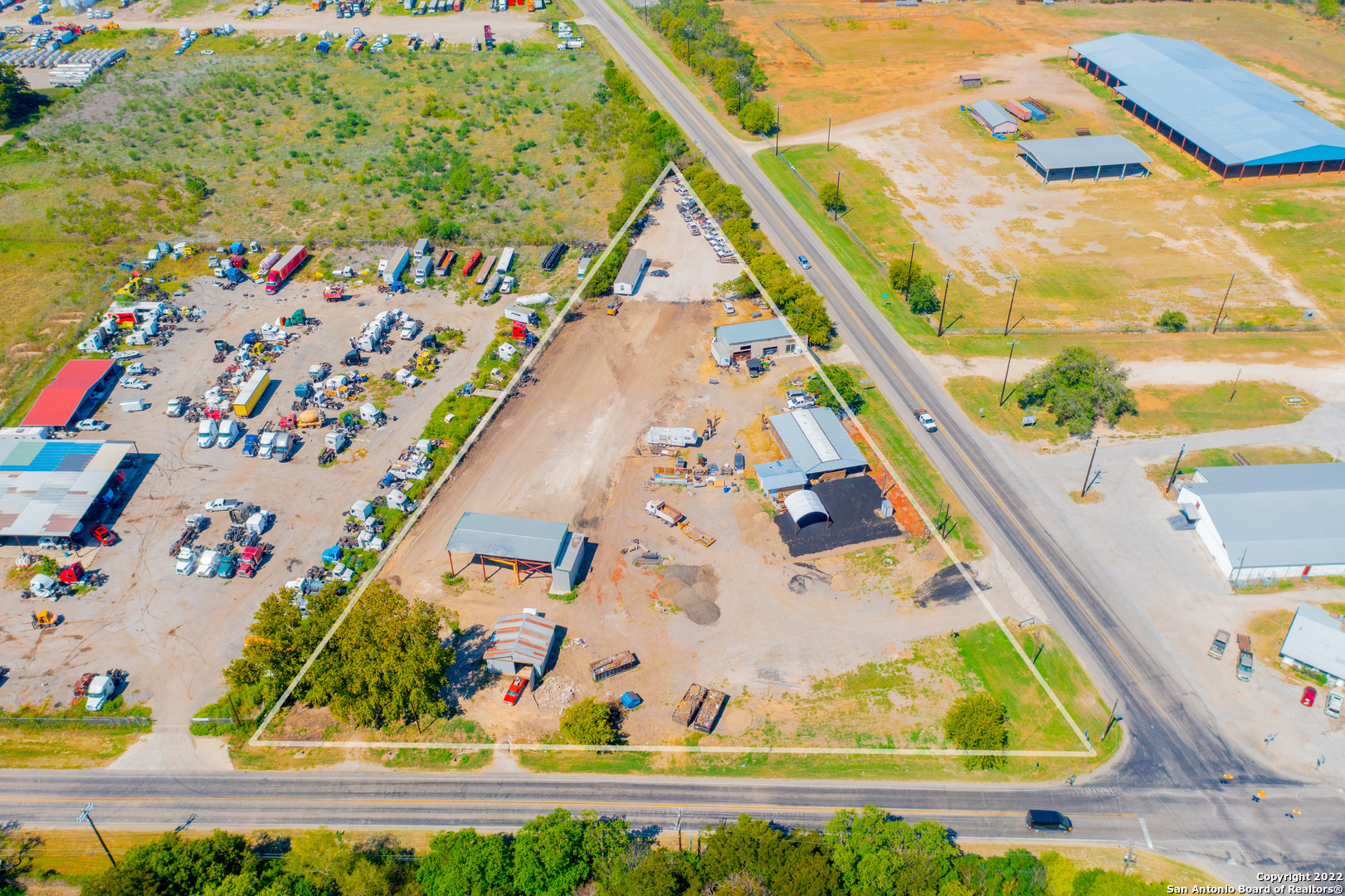 Large 2.8 acre corner lot commercial property in a great location! This industrial use lot includes a modular office, 2 carports, and additional storage buildings. You can make use of any structures currently on the property, or clear it and build new structures. Close and easy access to the major freeways like I-10, 410 and 1604. The property is also located minutes away from HEB, Dollar General, and Amazon warehouses.