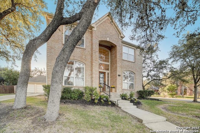 Located in NW SA, conveniently located at 151 and 1604, a short commute to SeaWorld, Hyatt Hill Country Resort, Six Flags, Lackland AFB, shopping, and downtown SA. This stunning sunlit two story in sought after Stonegate Hill on a corner lot, cul-de-sac, has 4 beds, 2.5 baths, detached 3 car garage has a sitting room to the right at entry, separate dining area with wainscoting, a gourmet kitchen which opens to the living room with soaring ceilings and above mirrored fireplace. The kitchen has granite counters, stone tiled backsplash, breakfast bar, stainless steel appliances, and breakfast nook. The master is down with celestial windows & overlooks the backyard. Master bath has a separate shower from a soaking garden tub, double vanity, and x-tra large walk-in closet. The second floor has gameroom/media room with built in audio speakers, 3 bedrooms, with hall entry bathroom with travertine floors. Fabulous cozy backyard has an adjacent oversized driveway, mature trees and atop the roof, efficient solar panels. The backyard is perfect for entertaining or just relaxing after a long day. Come see this beauty! ***Seller to provide a $10,000 concession for repairs and/or closing cost assistance with a full price offer. ***This can be a VA assumable loan at 4.5% with current mortgage co.*** Please inquire with me for more details.