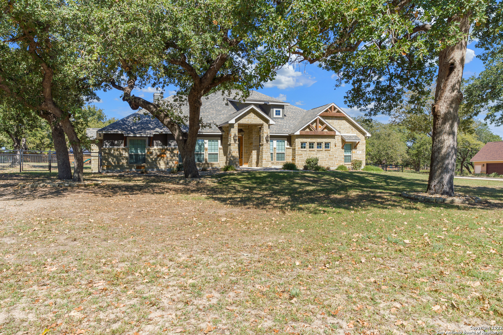 Wow, this beauty has it all! Rustic elegance meets style on 1 acre with a pool! This home was featured on the front cover of HOMES & LAND MAGAZINE in 2019 upon completion of build. Gorgeous Texas hill country home with rock and stucco exterior. This home is meticulous and move in ready. Welcoming front lawn and landscape with extended driveway. The large open floor plan is perfect for entertaining. The interior features wood beams, abundant natural light, a stunning rock fireplace, and the mesquite mantel is local artisan crafted. The kitchen features leathered granite, custom 'antiqued' cabinetry, marble tile backsplash and SS appliances. Master bedroom has beautiful cedar ceiling beams and a spacious master bath. Come enjoy the backyard oasis featuring the recently installed Bode in-ground pool with adjoining hot tub, a recently installed covered gazebo w/electricity off the pool for those summer BBQs and for additional seating. Professional rock and landscaping throughout backyard including sprinkler system and a new metal fence. Large covered back patio. Located on a cul-de sac street. This place truly has it all. Contact us today for more info or to schedule a showing!