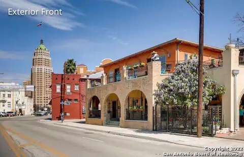 One of a kind building in downtown San Antonio built in the 1930s with a history as interesting as the city itself. historic condo living in La Villita Historic District. Walk just 1 block to the Riverwalk in several directions. Restoration has updated the major components while highlighting original details such as original terrazzo flooring, hand-milled woodwork, and exposed brick. Wrap around porches upstairs and down, w/pergola upstairs. With ceilings over 12 ft on the 1st floor, a sunroom off the master suite and a large family room, spiral staircase & elevator. With additional 1 Bedroom/1 Bath attached Casita. Gated private 2 unit parking. Truly a unique property in the heart of downtown! You won't want to miss this opportunity!