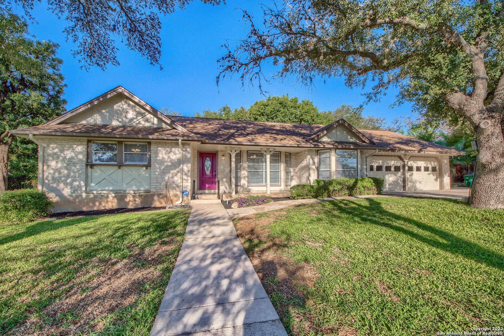 *OPEN HOUSE SUN. (1/29) 10:30-2!* OWNER FINANCING AVAILABLE FOR THIS GORGEOUSLY RENOVATED CASTLE PARK ESTATE ON A THIRD OF AN ACRE WITH A TANDEM THREE-CAR GARAGE AND CASITA! Nestled just between Lockhill-Selma and Blanco, just outside Loop 410 and Castle Hills, this home's location would be enough to shout about but to see it is to believe what a gem it truly is! Wind through the quiet, tree-lined streets past gracious estate homes on large lots & pull up to this classic single story, limestone rancher set up on a rise for stunning curb appeal and graced by mature oaks. Step inside to a welcoming home that leaves you wanting for nothing. Luxury wood-look vinyl plank flooring greets you at the foyer and stretches through the living areas and bedrooms. A huge living space is open to a formal dining both with views through charming bay windows. The ceiling opens to a beamed cathedral in the family room which boasts a centerpiece fireplace with long limestone bench from where you can enjoy a view of the lush, large backyard, shaded by mature trees. Chat with the chef in the kitchen who can cook with a gas range and have plenty of space to spread out the dishes with an expanse of upscale biscotti white granite countertops. New white shaker cabinetry, stainless appliances, an eat-at island with storage space, breakfast nook and granite topped coffee bar round out the offerings in this tremendous kitchen! As you head into the bedroom wing, notice all the new burnished bronze light, ceiling fan, kitchen and bathroom fixtures that offer a consistent look of high end luxury. The master suite is tucked at the far back corner of the home with a large walk-in closet, access to the backyard and ensuite bath. Check out this bright, happy, luxurious bathroom with a bay window, double granite vanities, custom mirrors and a sleek step-in shower to die for with its glamorous glass, custom tile work and two shower heads! The secondary bedrooms are roomy and share an oversized bathroom with travertine tile surround, double granite vanity and a walk-in shower than can accommodate folks in wheelchairs or walkers. The utility room is as large as a bedroom with cabinetry storage, and space for shelving, storage, ironing board and/or extra fridge. The attached garage is sure to please with double doors, tandem space for 3 vehicles or two with a big space for workshop or storage. It is textured and painted so would easily convert to living space if needed, but who needs that with the casita out back!  Step through a door at the rear of the garage to your efficiency guest house, so cute with a small front porch with a perfect view of the expansive backyard. Inside find luxury vinyl flooring, natural light, a full brand new bathroom with walk-in shower and room for futon or bed and sitting area ideal for mom or out of town guests but also suited for an office or to rent out as you can access it separately from gate at the extended driveway! Enjoy the peace of your property on cool fall evenings from the long, covered back porch.  The alley behind offers an additional buffer for privacy from the neighbors. The driveway widens at the garage to 3 vehicles width then continues along the side of the garage for extra outside parking, RV storage, and direct access to the backyard and casita. A sprinkler system on your full 1/3 acre makes keeping a green St. Augustine lawn easy! Make note of the four-sides rock, gutters front and back and 30-year shingles. All this set in one of the most sought after established neighborhoods in North Central-- aesthetics and convenience just north of 410! 10 minutes from the Quarry and the Pearl and easy commutes downtown to I-10, 281, Fort Sam, SAMMC and Lackland. NEISD. This beauty is a classic mid-century charmer with all the modern updates -- proof they don't build them like they used to! Add to this perfect recipe the magic ADU (Additional Dwelling Unit!)/Casita for rental income, detached office or guests.