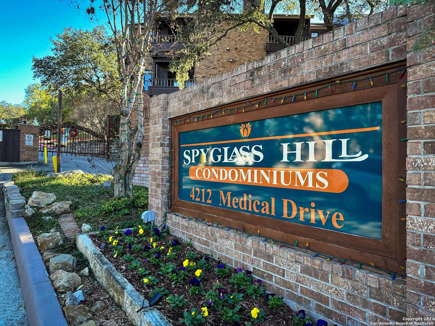 Welcome home to this spacious and beautifully updated condo in the popular, Spyglass Hill Condominiums. Located in the heart of the medical center and with over $30,000 in recent upgrades- this ground floor, end unit, condo is move in ready! At 860 square feet, the two bedroom and one bathroom floorplan provides ample space for living, cooking, and dining. In the kitchen you'll find all new Whirlpool appliances and new tile floor. The second bedroom could be used as an office or den, complete with a wetbar and sink. The bathroom has been updated with new tile floors, beautiful vanity, and walk in shower. In the primary bedroom there is ample storage with a roomy, walk in closet. The interior has been freshly painted and new, plush carpeting was installed. Other updates include all new ceiling fans, two inch blinds for privacy, and brand new drapes. And lucky for you, the interior and exterior HVAC system has been completely replaced! Outside you'll find a comfortable patio with a washer and dryer which will remain with the condo. Other perks of this beautiful condo include a quiet and gated community, two pools, and tennis courts. Come see Unit 1301 today!