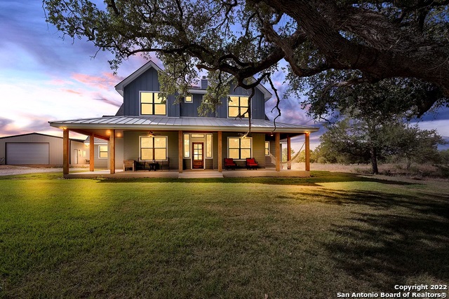Open House on Saturday 2/25/23 from 12-4pm!!! Stop by and bring your buyers to see this beautiful home in person.  Welcome to this beautiful modern Farmhouse located in La Vernia, Texas!    Open floorpan, vaulted ceilings in the living room area, big beautiful windmill ceiling fan, sliding glass doors and lots of windows throughout the house for all the natural lighting. There is an office with barn doors on the main level. It has the perfect entertainers kitchen for all of your gatherings. It has custom built cabinets in the natural wood color matching the wood floors throughout the house. The kitchen and master bath counter tops are made of Brazilian marble and honed lilac marble in the laundry room and quartz in the other two bathrooms are just a few of the many upgrades this custom built home has to offer. The home also has a large walk-in pantry with extra space for a freezer.    This home has 4 bedrooms and a large family room upstairs with a closet that can easily be converted to the 5th bedroom if desired.   But wait until you see the Master bedroom and you will fall in love with the garden iron tub to enjoy a glass of wine after a long day of work or the walk-in shower with the rainfall shower head (your choice).    Beautiful Country style covered patio with a swing to enjoy the evenings. Outside you will find a pond and a 30x30 shop perfect for country living enjoying your 10 acres. Hunting allowed and horses allowed. No HOA, the possibilities are endless on what you can do!   This home is ready for new owners, schedule your showing today!