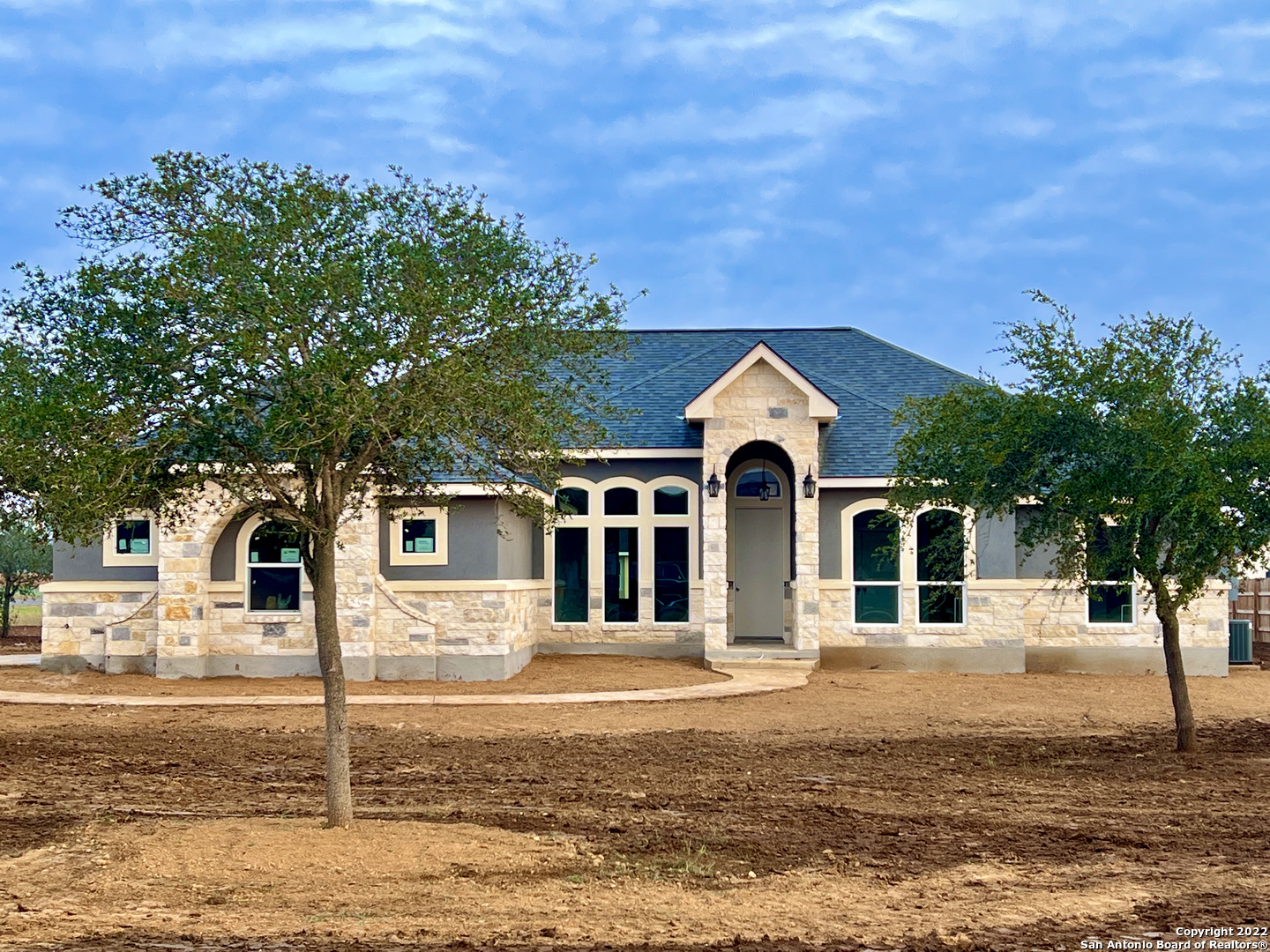 Country Living, Custom New Construction Home in The Granberg Subdivision in Lytle TX. .75Acre Lot, 4 Bedrooms, 2 Bath. 2185 Sqft. Numerous Custom Upgrades, Kitchen w/ custom cabinets & granite countertop. Master Br. w/ Large Walk-In Shower, Separate Spacious Vanities & Lg. walk-in Closet, High Custom Designed Ceilings thru-out. Open Floor Living Rm. leads to a TX Size Yard w/covered patio great for Entertaining, Secondary Bedroom can be used as Media Rm/Office. Oversized, finished & insulated 2 Car Garage can be used as home Gym or workshop. 25 minutes from Downtown San Antonio.