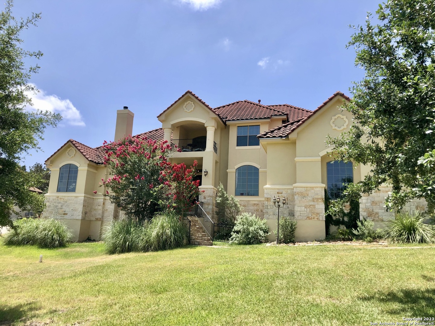 Located in the highly desirable city of Garden Ridge within the quiet gated community of Georg Ranch, this custom-built 4-bed, 3.5-bath, oversized 3-car garage is one you'll not want to miss. In a great location this house in the hill country is near schools, shopping, entertainment, and more. Upon entering this home, you will be greeted with gorgeous soaring ceilings and elegant architectural designs with a beautiful gas/wood fireplace highlighting the formal living room. The main level includes an office, flex room, gourmet kitchen, and multiple open spacious living areas. Also located on the main floor the large master retreat has a spa-like en suite and his and her walk in closets. This home boasts beautiful arches from room to room and stunning tray ceilings throughout which are highlighted by crown molding. The second floor offers 3 more bedrooms, two bathrooms and a balcony perfect for watching the sunrise. The spacious backyard is perfect for entertaining and has plenty of space to add in a pool.