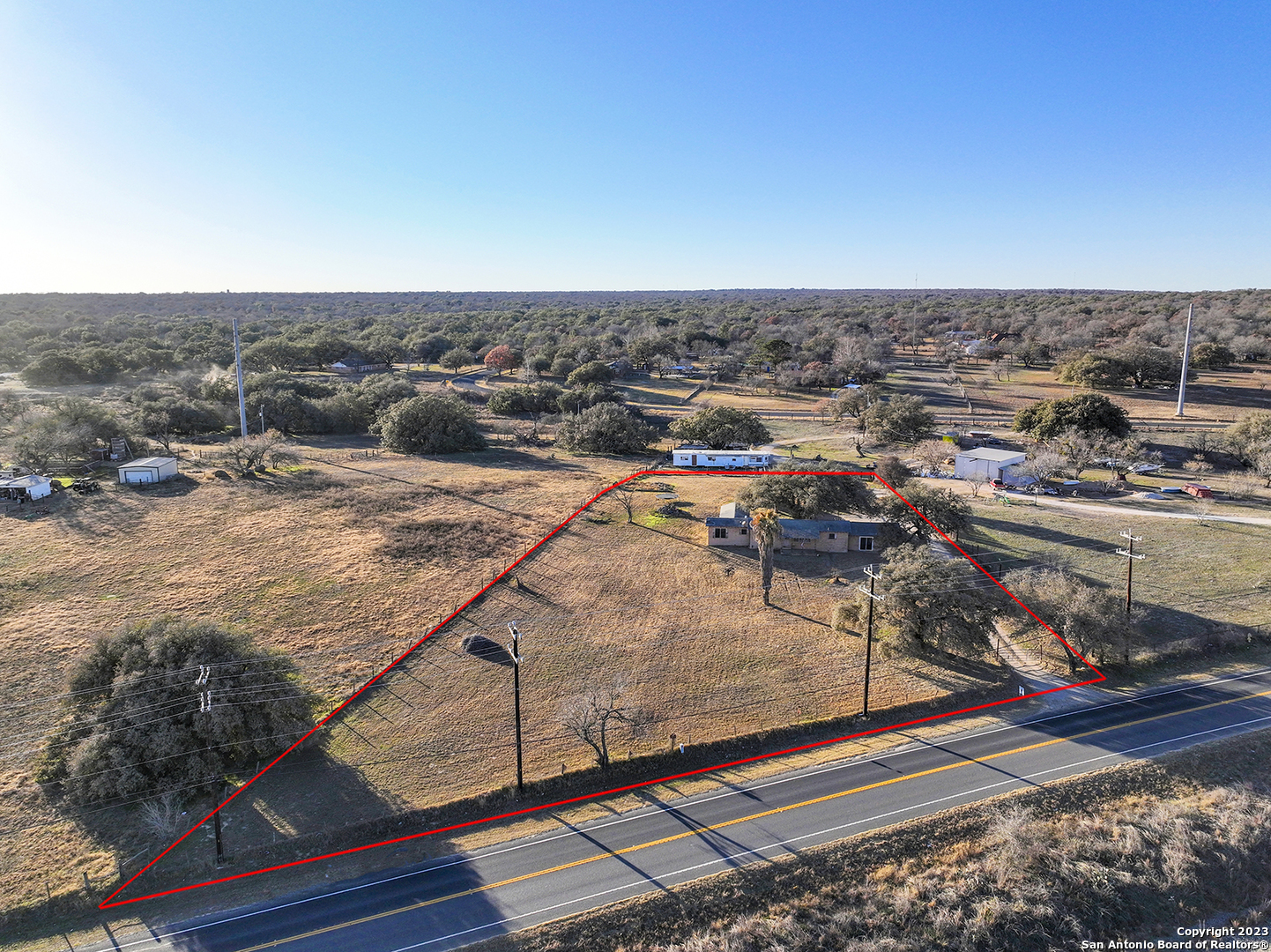Priced Reduce! 1.65 acres of peacefulness. Have you thought about having goats or chickens or farm animals? Don't want to hear your neighbors TV? Then this is the spot for you! Smell the fresh hill county air, situated outside 1604, 28 mins to downtown San Antonio and 15 minutes to Texas A&M San Antonio University. Three bedrooms including a primary suite with walk in closet and dual sinks. Guess bath to include a tub/shower combo and single vanity. In house Laundry room with multiple shelves great for storage. Two bonus rooms, one converted into a BAR, and the other it's up to you to get creative. Don't miss the chance to own this unique opportunity. Schedule your showing today!