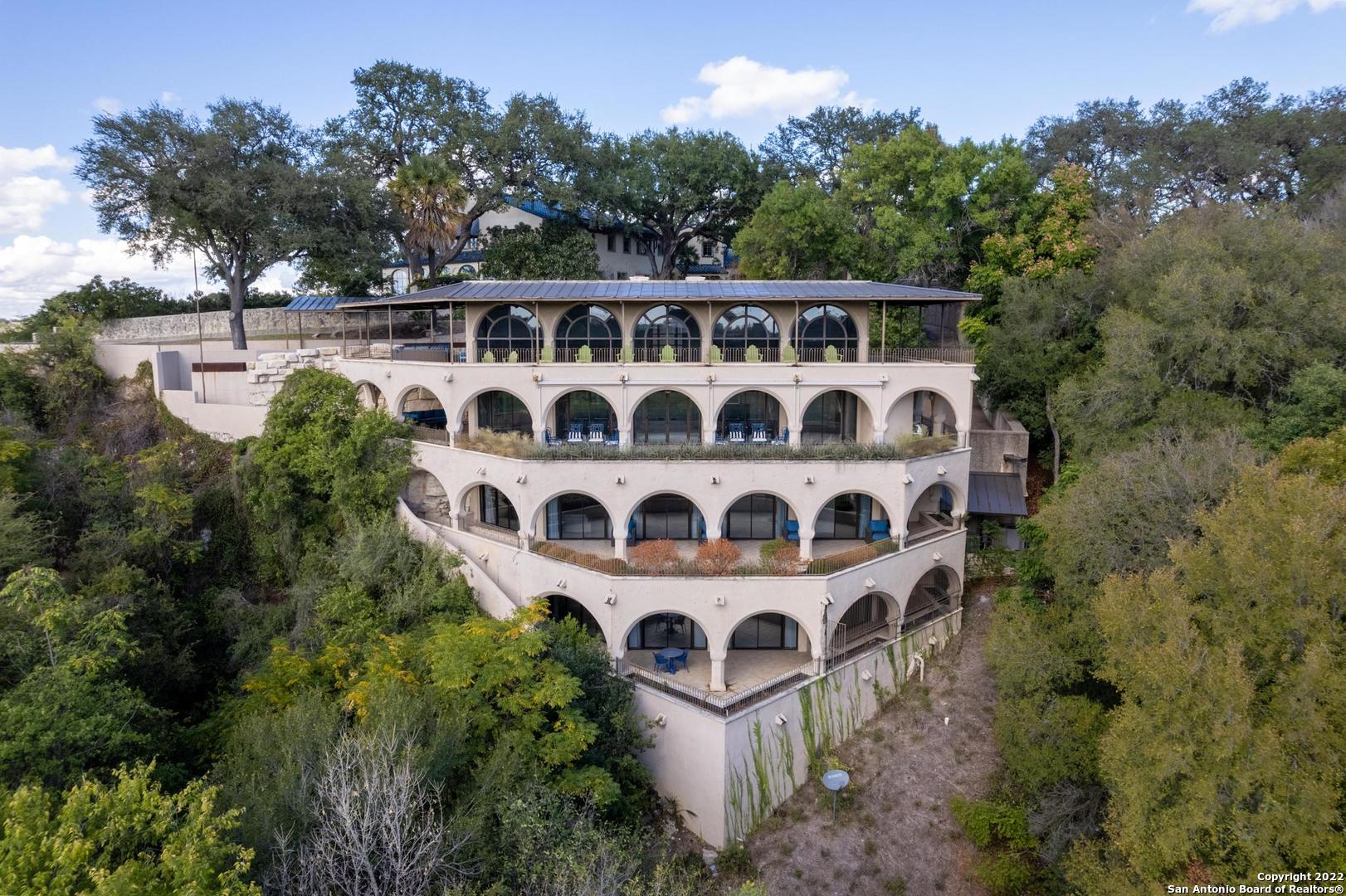Iconic Alamo Heights home, designed by Tom Pressley and built by Bartlett-Cocke in 1986. This amazing multi-level home features floor-to-ceiling windows with views of the Olmos Dam, Olmos Basin and skyline views of downtown San Antonio.