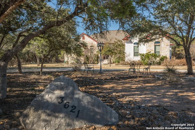 This amazing Hill Country home is ready for new owners. Home is situated on almost 2 acres with a pool and tons of privacy.  Gourmet kitchen features granite countertops, stainless steel appliances, double ovens, birch custom cabinets with pullouts.  Master bedroom is privately located with view of backyard, master bath has his and hers vanities and closets.  Guest suite is located off the kitchen area with private bath.  Lots of natural light.  Plantation shutters throughout home add to the elegance.  Covered patio leads out to the sparkling heated pool with spa, outdoor kitchen and more seating areas that are great for entertaining.  Exterior recently painted. Gated and desirable neighborhood, high ranking schools, shopping, and restaurants conveniently located. Great access to Loop 1604 and Hwy 281 N.