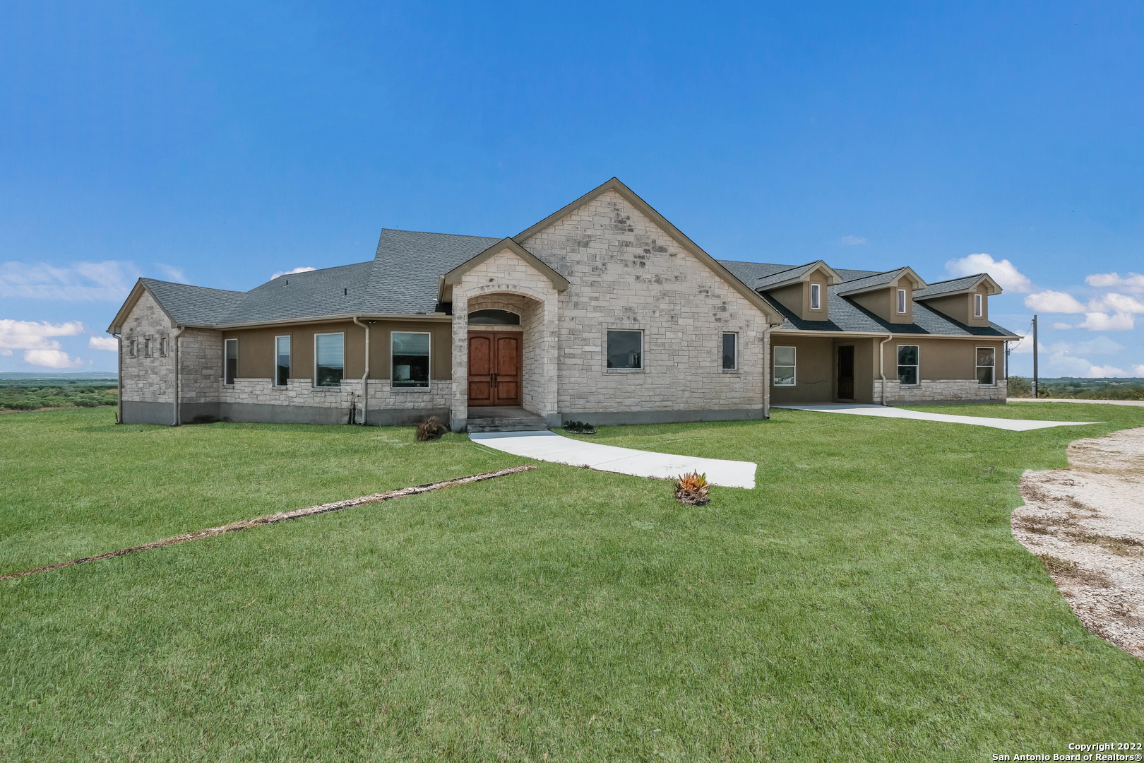 Two Homes on 62 acres and 1/3 interest on 18 river front acres Main House: 4 Bedroom 3.5 Baths with water well Guest House: 3 Bedroom 2 Bath with water well  * 3,000  ft of frontage on the Medina River * Hilltop views * Fertile farmland * Pond * Ag Exemption * County Road frontage * Medina Valley ISD