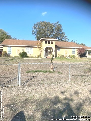 Come get your dream home!  4 minutes from downtown San Antonio.  This home has 2 kitchens, 3 living rooms, 5 bedrooms,2 eating quarters, 2 laundry rooms, 3 bathrooms which one is outdoors connected to covered patio.  Huge spacious front, and backyard 1.5 acres ready for its new owner.  Zoned R-6