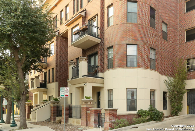 Experience San Antonio brownstone style luxury living in the heart of downtown. This 2 bedroom, 2.5 bath Townhome adorns high ceilings with a large open kitchen for entertainment, includes Viking stainless steel appliances, granite and marble countertops, Brazilian cherry wood floors, travertine tile, beautiful lighting fixtures throughout, with plenty of large windows to light the home. Enjoy private living entering in and out with your own gated front porch directly across historic jewels of downtown; walking distance to the Alamodome, St. Paul Square, Hemisphere Plaza, Riverwalk, the Alamo, and bike riding distance to the historic Pearl district. Enjoy 2 amazing parking spots directly next to back door in the secured garage. Amenities includes a swimming pool, 20th floor Sky-room, BBQ area, 2 guest suites, business center, fitness center and 24/7 concierge.