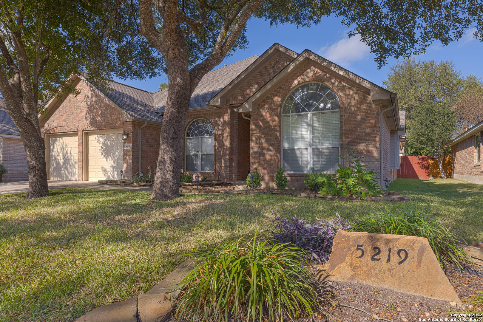 It's the most wonderful time of the year to tour this beautiful home!! Located in the desirable gated neighborhood of Oakland Heights in San Antonio, just minutes from I-10 & 1604. This home has a spacious open concept design w/ tall ceilings and lots of natural light throughout. There are two living areas, a dining room and an eat-in-kitchen. High end finishes w/ marble countertops and wood floors. The island kitchen features double ovens, a cooktop and a breakfast bar. This home is light & bright and has touches of character throughout such as the front door, fireplace, ceiling detail and upscale bathrooms. A private patio/courtyard can be seen from the living room and primary bedroom windows. Great backyard includes a storage shed. Prime location close to the RIM, La Cantera, UTSA, & Six Flags. Come out and tour this gorgeous, one of a kind property today!!