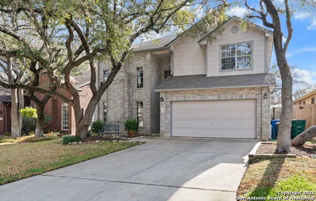 Mature trees surround this lovely 2-story home in Oak Hollow Estates. Conveniently located on the North side of San Antonio close to US 281 and Loop 1604, this 4 bedroom home features a guest bed/bath down with master and secondary bedrooms up. The front living includes a gas fireplace and a back family room close to the open kitchen. Granite counter tops in the kitchen and lovely ceramic tile give just the right feel. The upstairs master includes recent updates to the bathroom giving a luxurious feel. The backyard provides a peaceful retreat with tall trees and an arbor sit under with family and friends. Come see this beautiful home today!