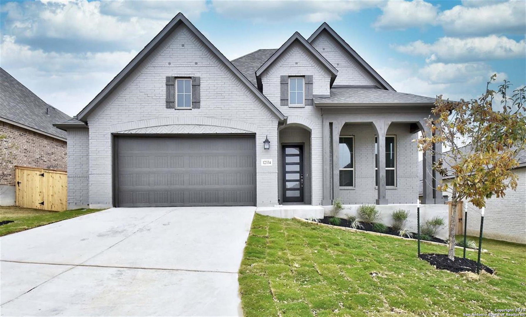 MLS# 1599805 - Built by Highland Homes - CONST. COMPLETED Nov 15 ~ This ONE level brick home boasts 12' ceilings, open floorplan, white and gray interior palette with white cabinets and porcelain tile floors, large breakfast-dining with 5 windows and very large family room.