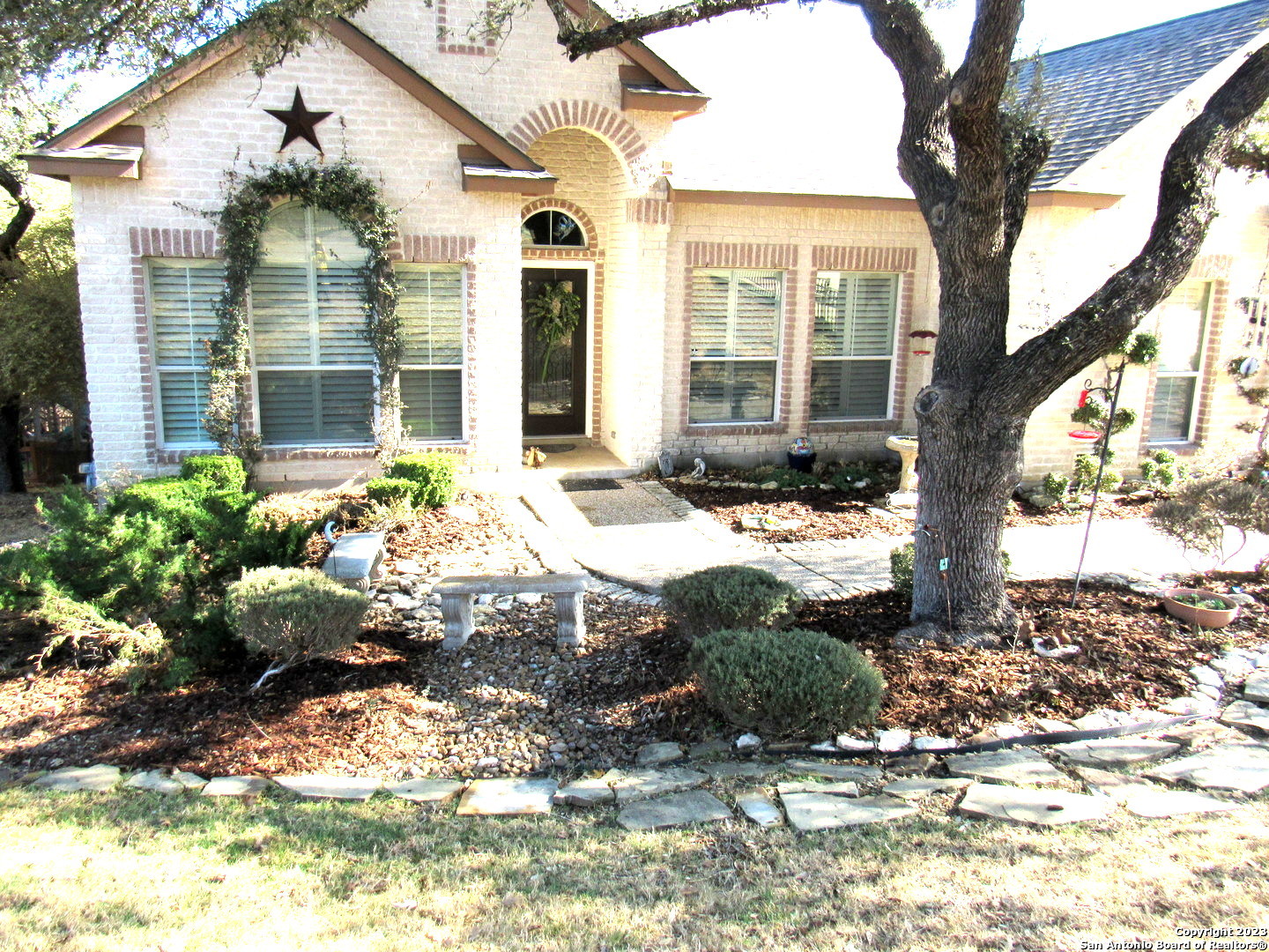 .64 of an acre with an additional green belt that gives a wonderful park setting, all inside of 1604!  Plenty of mature trees that compliment the custom decking for relaxation and entertainment.  The Leon Valley Hiking and Bike trails are walking distance from the properties back gate.  All conveniences and schools are close by, with Medical ctr, VA, UTSA locations, as well. The neighborhood has only 1 entrance/exit eliminating traffic flow.  Some of the features are fully fenced yard, landscaped with concrete walkways, 4 sides brick, 10 ft ceilings throughout, fireplace, soft water system, irrigation, custom plantation shudders every window, security system, metal keyless front door, ring doorbell, wood/tile flooring - no carpet, 2 sheds (garden, utility) Bright updated kitchen with cabinets, upgrade lighting with solar, touch faucet, plenty of additional granite counter seating for gatherings.  Study has closet and can be used as a bedroom.  Come and enjoy family living in this great home.