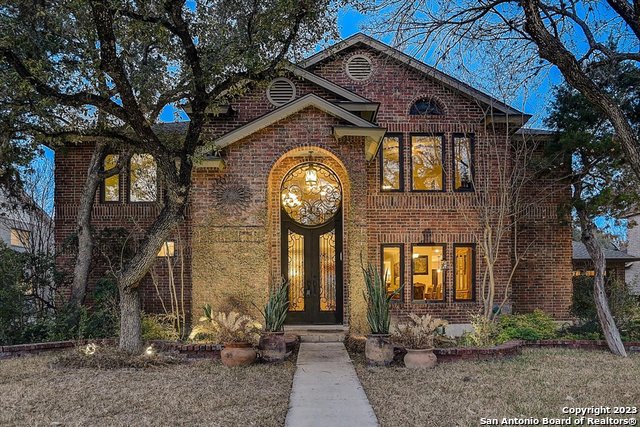 Welcome home to this exquisite 5 Bed/2.5 Bath, two story four sided brick residence located in the gated neighborhood of Salado Bluff. There are less than fifty homes in this quiet neighborhood. The almost half acre property backs up to a greenbelt overlooking Salado Creek Linear Park with walking and biking trails that are easily accessible from the neighborhood. The great open floor plan layout welcomes you in with two living areas, cozy fireplace with gorgeous wood and travertine tile flooring throughout. Tons of natural light flooding in from custom double pane Anderson windows installed approximately 5 years ago. The warm eat-in kitchen features custom cabinetry, a large island, stainless steel appliances, walk-in pantry with lots of storage. The impressive master retreat downstairs features a walk-in closet, double vanity and spacious shower. Custom wrought iron stair railing leads to the second floor. Two of the upstairs bedrooms each have walk-in closets and one of the four upstairs bedrooms can be used as a home office. An entertainer's dream awaits you outside with the outdoor space complete with a dazzling pool that is pre-wired for a heater.  Outdoor kitchen with wood burning pizza or bread oven, concrete countertops, undermount sink, refrigerator, gas burner cooktop, drop in gas grill and smoker. It also features a remote retractable television that can be hidden when not in use. Additional upgrades and features include: custom wrought iron entry and backdoor, water softener and reverse osmosis drinking water purifier, a 20x28 covered patio with recessed lighting, built-in speakers, 3 ceiling fans and 4 skylights. A 16x23 workshop is attached to the back of the garage, and there is also a 10x24 storage shed. Enjoy all this home has to offer and MORE! Schedule a showing today.