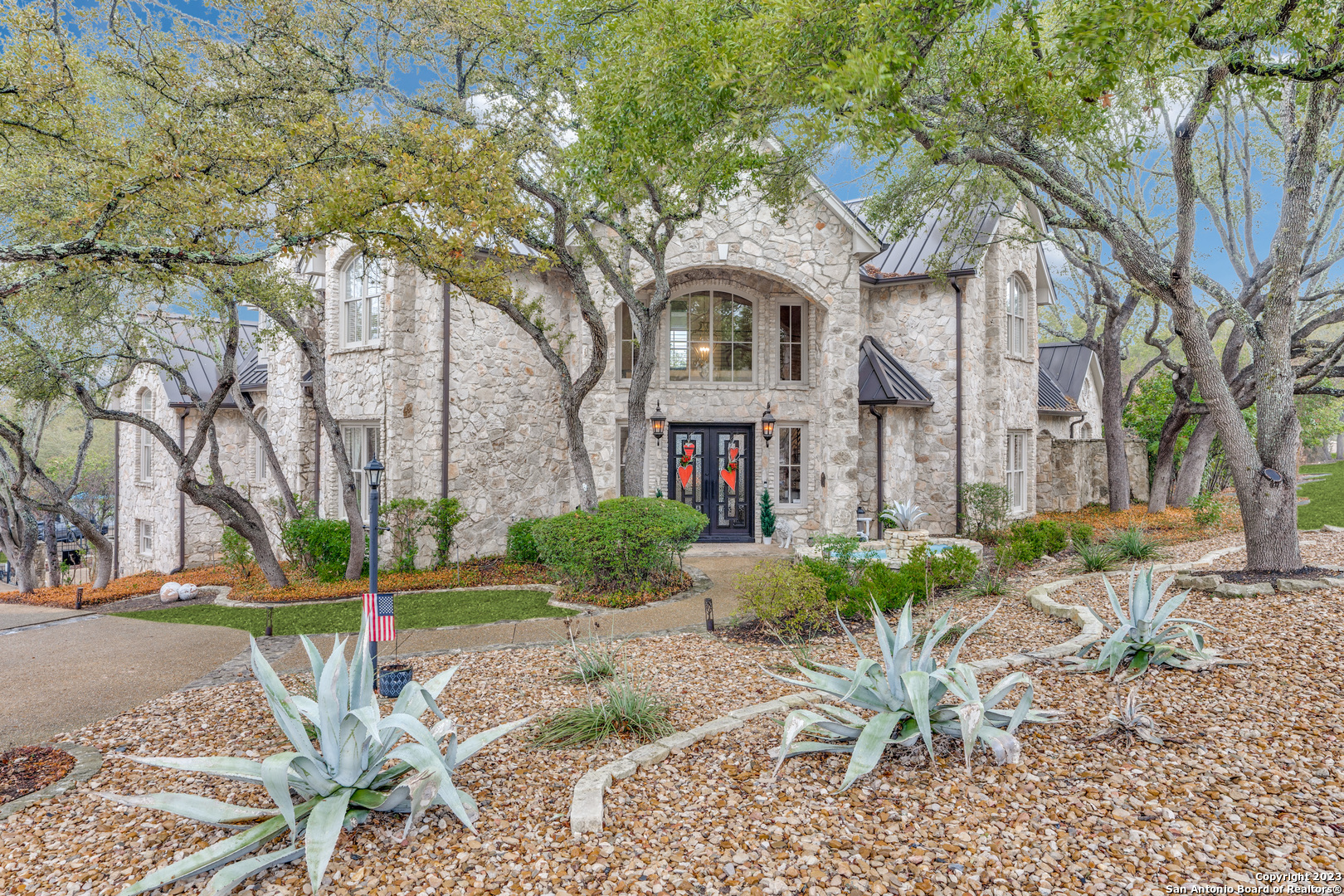 Exquisite, finely-detailed transitional modern estate in the luxurious subdivision of Dominion. This community offers an option to be a member of one of the premier private country clubs in San Antonio. A rare find, nearly an acre of land! The exterior has a regal fashion that consists of natural stone with a breathtaking double door front entrance. The interior has been professionally designed and decorated with wains coated ceilings, custom cabinetry, stone accents, recently renovated staircases, wet bar and a rich wood paneled study. 5 bedroom, 5.5 baths, large game room, media room with newly added surround sound. Two fireplaces. Primary and  a secondary is on main floor. Oversized private backyard oasis with built in kitchen, over 28k recently renovated salt water Kieth Zars heated pool, and spa. Roof and garage doors replaced in 2020, subzero built in fridge, Jenn air gas multi burner stove range with double ovens, Bosch dishwasher. Schedule a private tour now!
