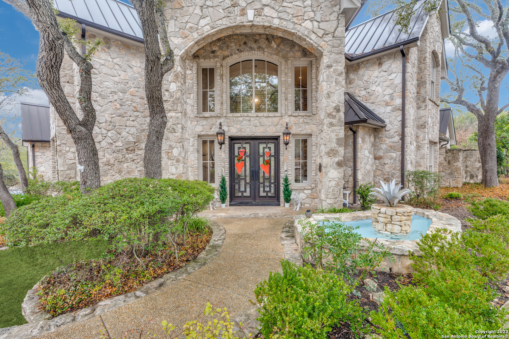 Exquisite, finely-detailed transitional modern estate in the luxurious subdivision of Dominion. This community offers an option to be a member of one of the premier private country clubs in San Antonio. A rare find, nearly an acre of land! The exterior has a regal fashion that consists of natural stone with a breathtaking double door front entrance. The interior has been professionally designed and decorated with wains coated ceilings, custom cabinetry, stone accents, recently renovated staircases, wet bar and a rich wood paneled study. 5 bedroom, 5.5 baths, large game room, media room with newly added surround sound. Mstrbed and 1 bedroom on first floor. Two fireplaces. Primary and a secondary is on main floor. Oversized private backyard oasis with built in kitchen, over 28k recently renovated salt water Kieth Zars heated pool, and spa. Roof and garage doors replaced in 2020, subzero built in fridge, Jenn air gas multi burner stove range with double ovens, Bosch dishwasher. Schedule a private tour now!