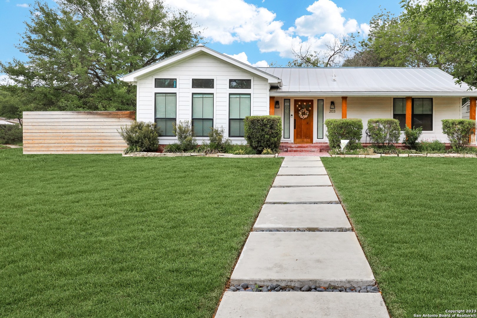 Beautiful Single Story on large corner lot in Alamo Heights Schools! Home was rebuilt in 2018 w/ a Modern Farmhouse design to include Light Wood Floors throughout, High Ceilings w/ Wood Beam, Custom Built-In's, Gas Fireplace & the perfect Open Floor Plan for entertaining! Gorgeous Chefs Kitchen features a Large Island, Breakfast Bar, Farmhouse Sink w/ Reverse Osmosis Filtration System, Wine Refrigerator, & GAS Cooking. XL Laundry Room w/ Custom Cabinets offering plenty of storage, Folding Station, & Mud Bench upon entry. Owner Suite w/ Outdoor Access, Luxury Bathroom w/ Separate Tub and XL Walk-in Shower w/ Rain Shower head, & Custom Designed Owner Closet. A true must see!