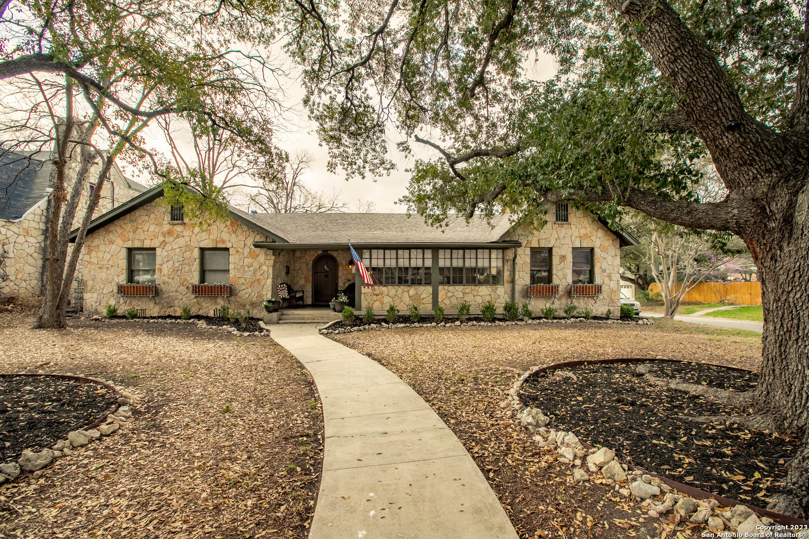 Charming stone home with oversized 1 bedroom casita in historic Monticello Park. This 1940's home has been meticulously restored while maintaining the historic charm like pastel/violet bathroom tile, built-ins, plaster walls, arched doorways, and exposed beams! From original windows, glass knobs, refinished hardwood floors, to the updated kitchen with butler's panty, this home has all the perks of modern upgrades while maintaining its historic charm. Enjoy a spacious, light filled living room with cozy fireplace, centrally located dining area, high ceilings throughout, and a generous secondary bedroom/study. Walk to Woodlawn Lake and enjoy fireworks from your large airy front porch, or your spacious, private backyard with large 2 car garage, and 420 sq ft casita.