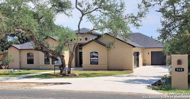 Enjoy peaceful living in this New Construction, True-Custom Built Single Story home in highly desired Timberwood Park! Located on half an acre, this 4/3.5 beauty boasts a tri-split floor plan with a Full Master Suite, including a rain shower head and soaker tub.  Across the home sits a full Mother in Law suite, and adjacent is the  Jack and Jill bath splitting the dual front bedrooms.  The executive office features double glass doors and overlooks the front of the home.  This home was built with Entertainment and Luxury in mind, so intro the jaw dropping kitchen with waterfall Quartz, a modern Farmhouse sink, pot filler, custom shaker cabinetry, and the wine fridge sitting just below a serving window.  The home features 2 backyard areas- a courtyard, and main area- both with custom decks and wrought iron railing, and includes a 3 car garage.  910 Slumber Pass is just down the street from the well known Timberwood Park that boasts a full lake, tennis and basketball courts, a community pool and splash pad, playground equipment, and a brand new $1 million+ clubhouse including a fitness center!   Available for move in- April 2023.